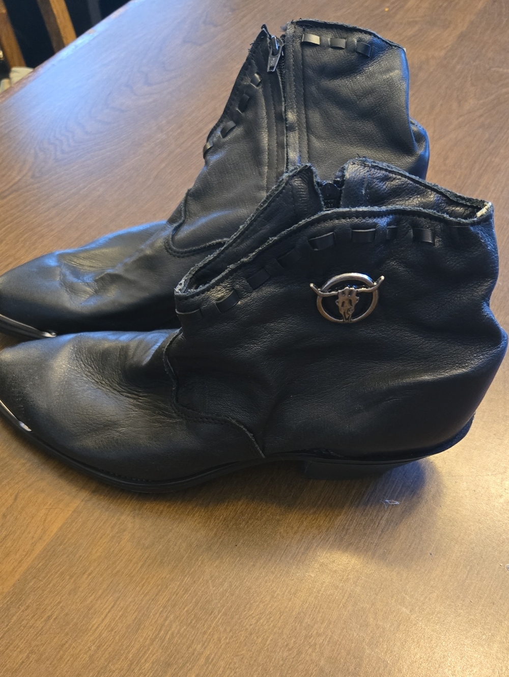 Black Women's Leather Ankle Boots with Decorative Emblem